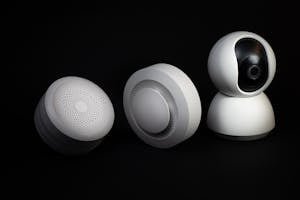 Elegant and innovative home automation devices on a sleek black background, showcasing modern technology.